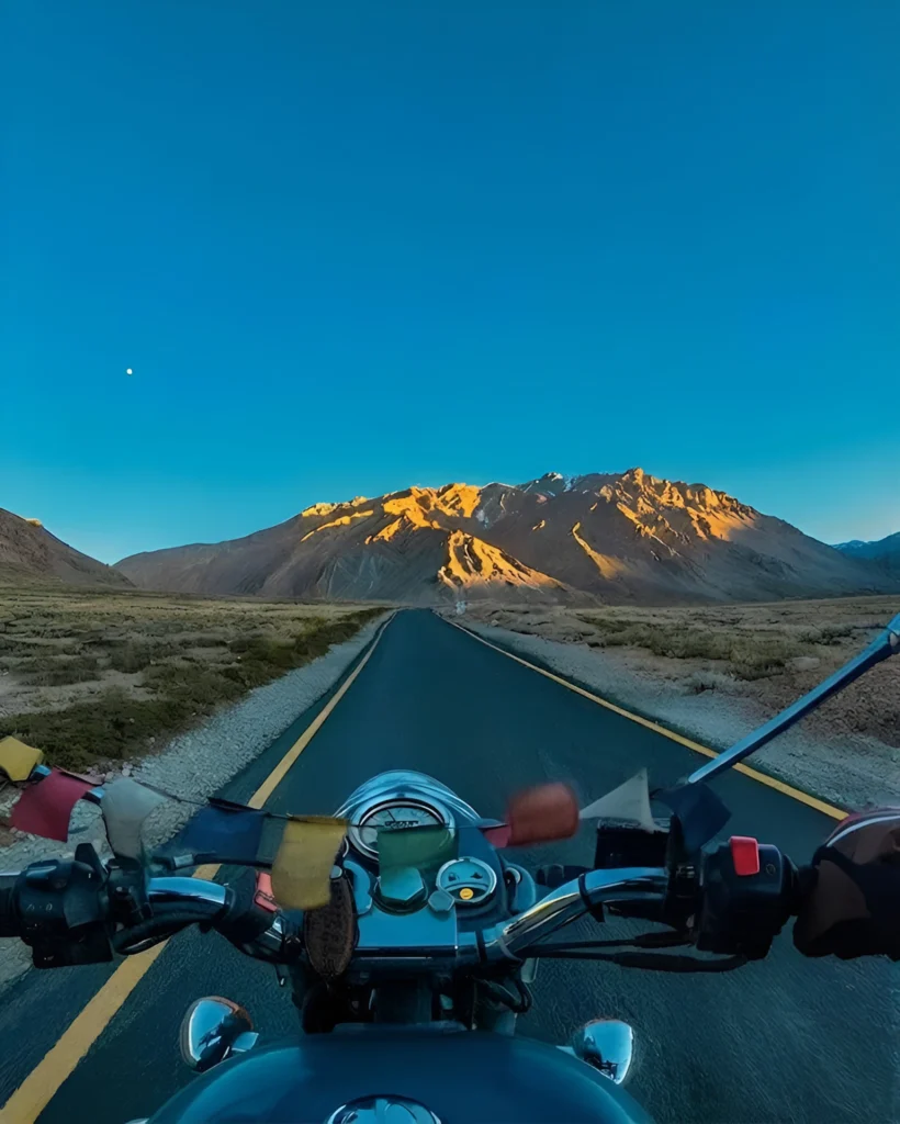 Leh Ladakh bike trip on a scenic Himalayan road with stunning mountain views
